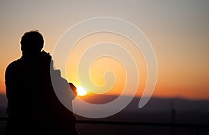 Silhouette of couple enjoying sunset over Freiburg, Germany