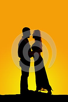 Silhouette of couple faces close