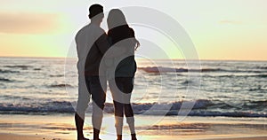 Silhouette, couple and hug on beach, sunrise and romance on holiday in Miami for happy summer and love. Travel vacation