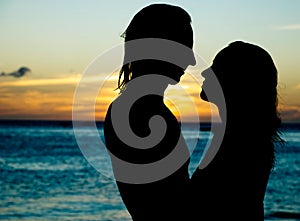 Silhouette of a couple at sunset photo