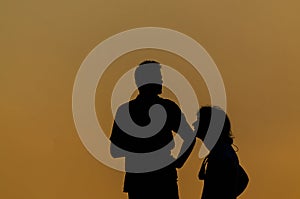 Silhouette couple talking