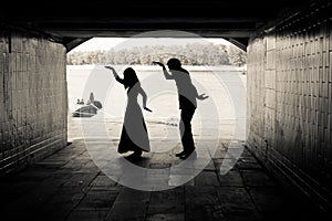 Silhouette of a couple in a tunnel