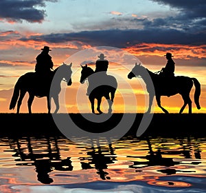 Silhouette cowboys photo