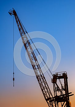 Silhouette crane construction site on sunset time