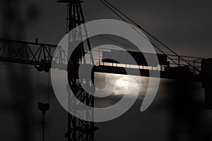 Silhouette of a crane at sunset