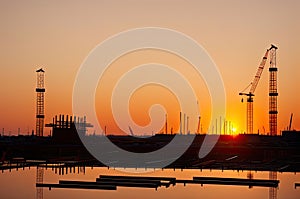 Silhouette Crane at Sunset on Construction Site. Generative Ai