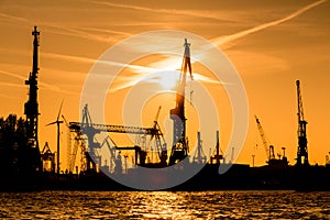Silhouette of cranes in the harbour