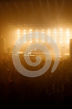 Silhouette of crowd raised hands on concert, music show