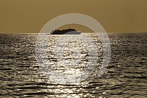 Silhouette of a cruise ship seen from afar