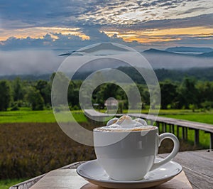 silhouette cup of latte coffee with viewpoint at the mountain in the Phu Pa por Fuji at Loei, Loei province, Thailand fuji mounta photo