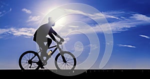 Silhouette of the cyclist riding