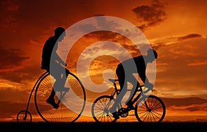 Silhouette cyclists on bicycles