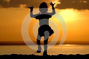 Silhouette of dancing child