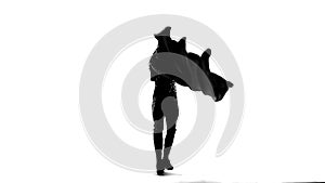 Silhouette Dancing man wearing a toreador costume. Isolated on white background in full length. Close up, slow motion.