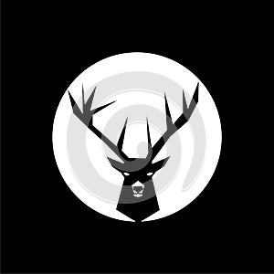 Silhouette of deer`s head with antlers isolated on dark background