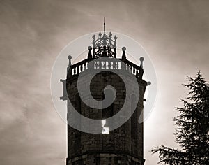 Silhouette and detail of the bell tower of the church of centelles with dramatic light photo