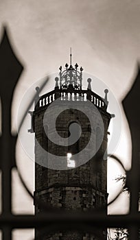 Silhouette and detail of the bell tower of the church of centelles with dramatic light photo