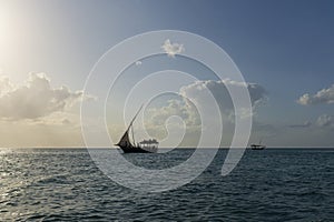 Silhouette of Dhow boat at sunny day