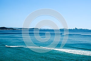 Silhouette of distant Surfer`s Paradise skyline along coast photo