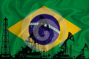 Silhouette of drilling rigs and oil derricks on the background of the flag of Brazil. Oil and gas industry. The concept of oil