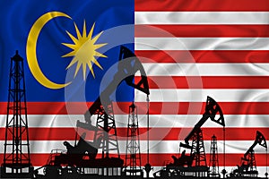 Silhouette of drilling rigs and oil derricks on the background of the flag of Malaysia. Oil and gas industry. The concept of oil