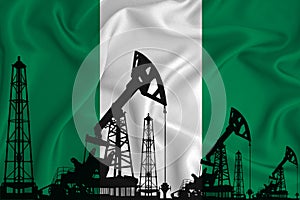 Silhouette of drilling rigs and oil derricks on the background of the flag of Nigeria. Oil and gas industry. The concept of oil