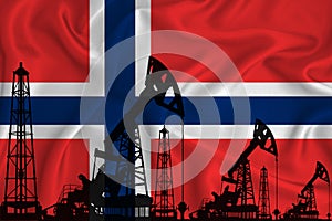 Silhouette of drilling rigs and oil derricks on the background of the flag of Norway. Oil and gas industry. The concept of oil