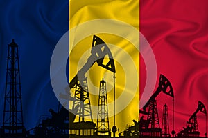 Silhouette of drilling rigs and oil derricks on the background of the flag of Romania. Oil and gas industry. The concept of oil