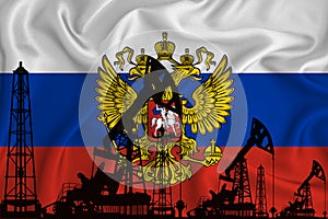 Silhouette of drilling rigs and oil derricks on the background of the flag of Russia. Oil and gas industry. The concept of oil