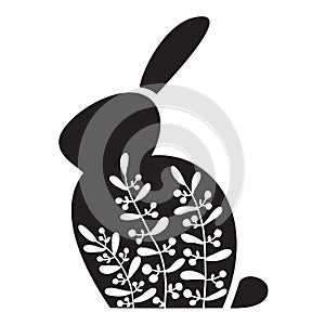 Silhouette of an Easter Bunny with white flowers on it. Black rabbit.