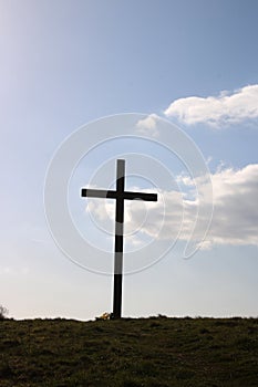 Silhouette of Easter Cross on small hill, Pilling