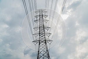 Silhouette of electricity post on blue sky background,