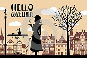 Silhouette elegant girl in hat with cup of coffee, lettering Hello Autumn, cafe table, tree, city houses. Vector