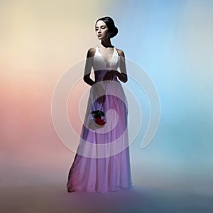 Silhouette elegant woman on colors background