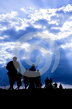 Silhouette of the emigrants on the way photo