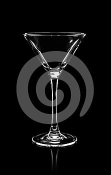 Silhouette of empty martini glass isolated on black background,