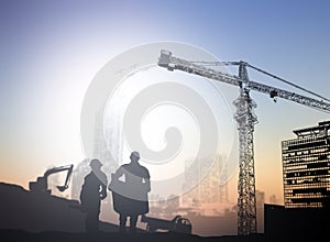 Silhouette engineer in a building site over Blurred constructio