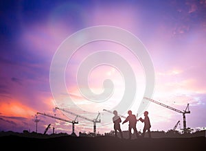 Silhouette engineer in a building site over Blurred constructio