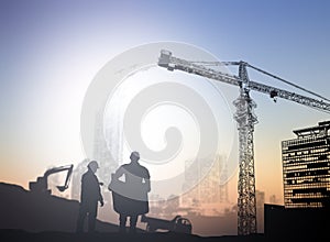 Silhouette engineer in a building site over Blurred constructio