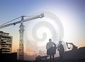 Silhouette engineer in a building site over Blurred constructio