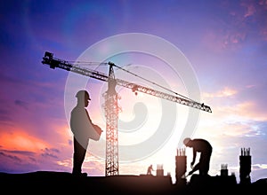 silhouette engineer looking blurred construction worker on construction site