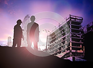 Silhouette engineer looking building site over Blurred construc