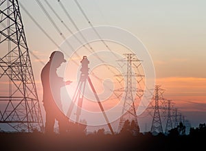 Silhouette engineer looking Loaders and trucks in a building sit