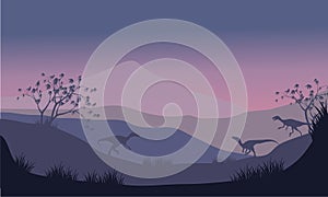 Silhouette of eoraptor in hills