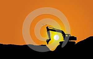 Silhouette of a excavator at sunset
