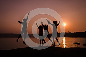 Silhouette family jumping