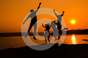 Silhouette family jumping