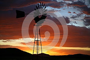 Silhouette of Farm Windmill at Sunset