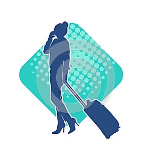 Silhouette of a fashionable female carrying a wheeled luggage travel bag. Silhouette of a business woman doing business trip