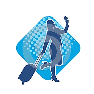 Silhouette of a fashionable female carrying a wheeled luggage travel bag. Silhouette of a business woman doing business trip